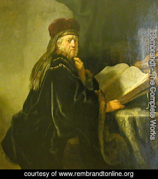 Rembrandt - A Scholar Seated at a Table with Books