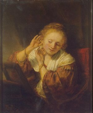 Rembrandt - A Young Woman Trying on Earings
