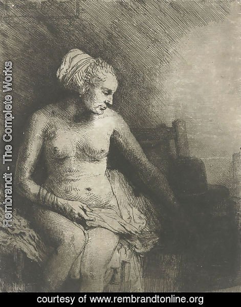 Rembrandt - A woman at the bath with a hat beside her