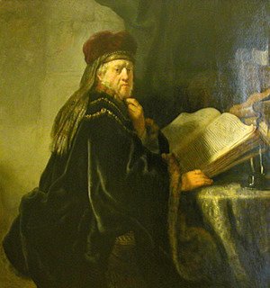 Rembrandt - A Scholar Seated at a Table with Books
